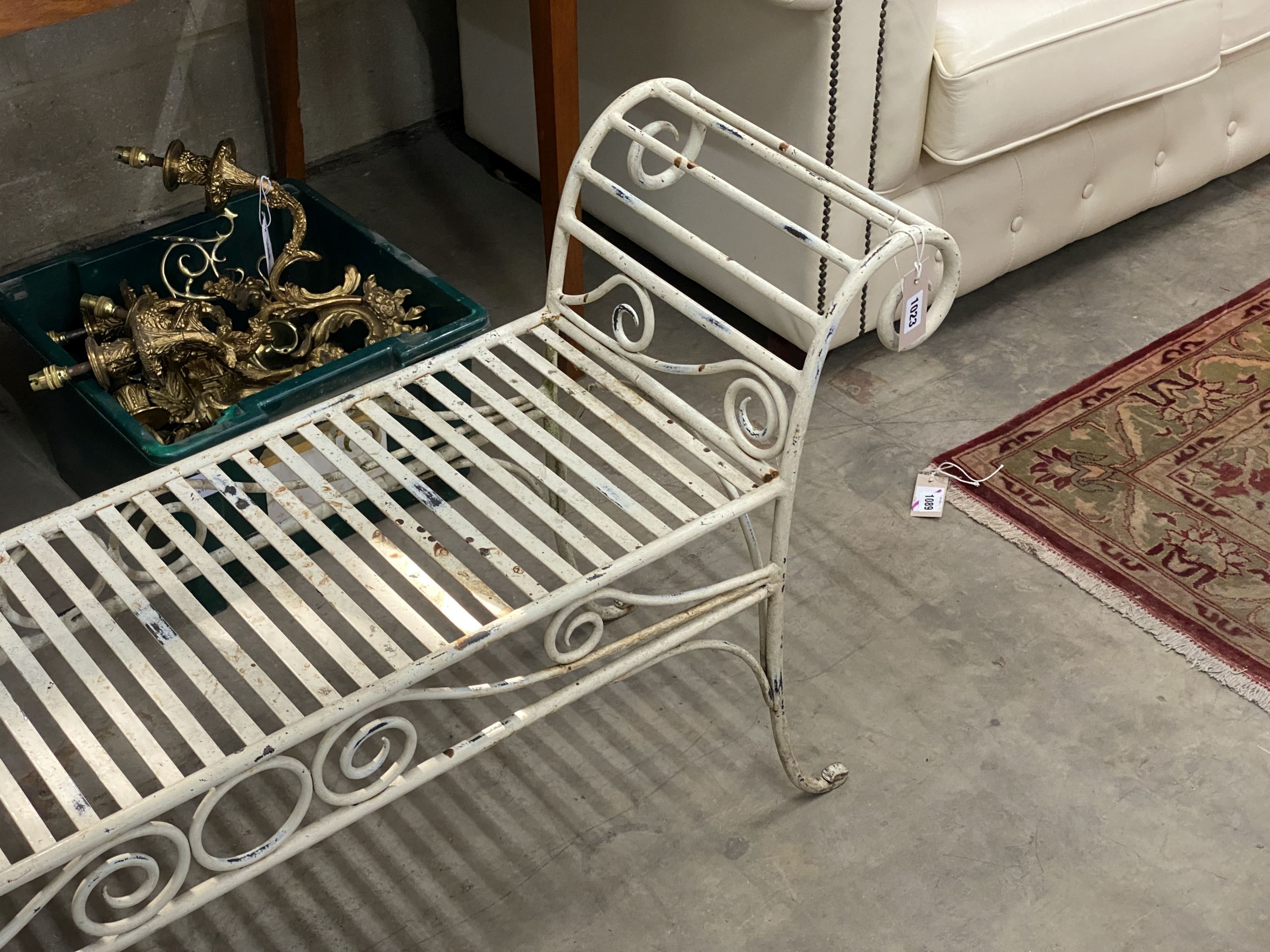 A painted wrought iron scroll end garden bench, length 130cm, depth 34cm, height 61cm